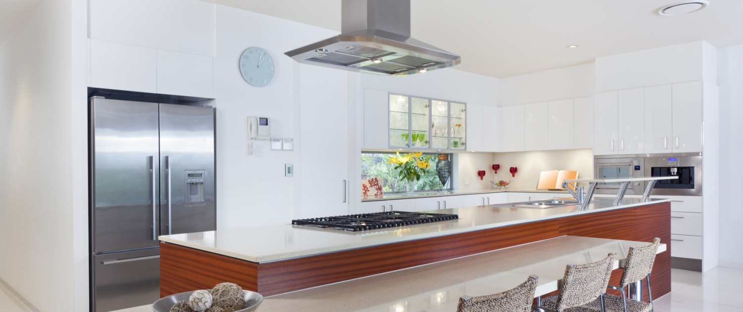 Modern kitchen with stainless steel appliances in Australian mansion